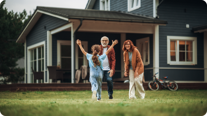 a family about to hug in front of a suburban home